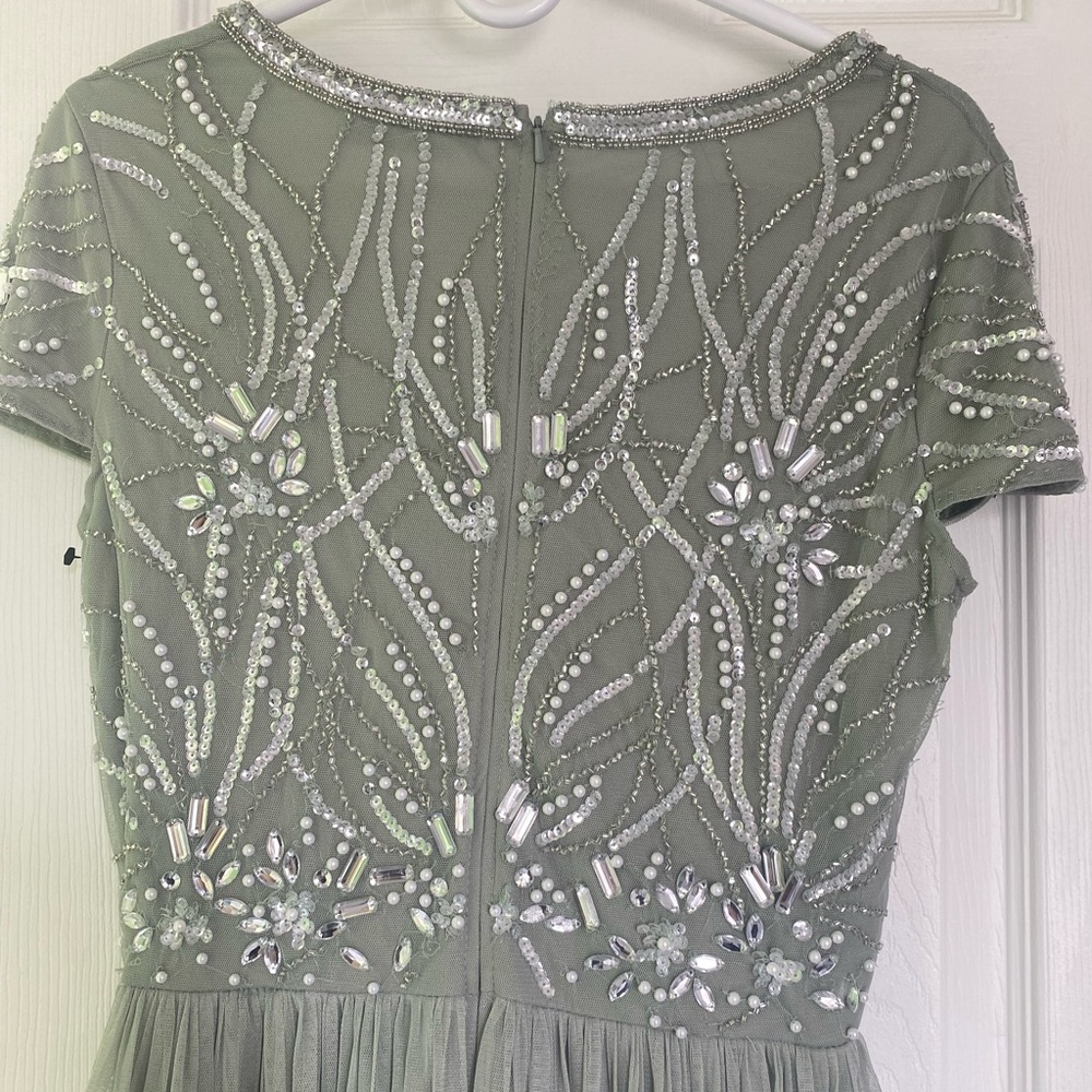 A beautiful long green dress for women in size 8 that is brand new